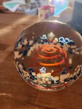 Clear Glass Paperweight With Blue & White Along The Middle, Red Swirl In Center picture