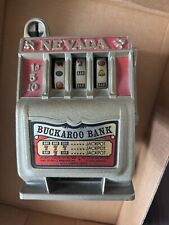 Vintage Nevada Buckaroo Metal Slot Machine Gambling Coin Bank picture