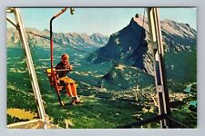 Banff-Alberta, Girl Riding Banff Chair Lift, Vintage Postcard picture