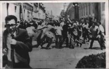 1962 Press Photo Student flees from fight broken out at protest in Guatemala picture