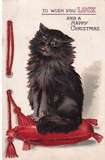 Black cat sits on red cushion, Louis Wain ?, Christmas greeting picture