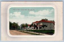 1910's ORLANDO FLORIDA VIEW ON EAST CENTRAL AVENUE HOUSES EMBOSSED POSTCARD picture