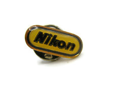 Vintage Nikon Pin Yellow Background Black Lettering Gold Tone picture