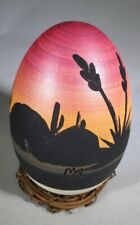Brightly Colored Pottery Egg with Desert Sunset picture
