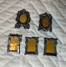 Minature pewter pictures frames 2 are oval shaped, 3 are rectangular picture