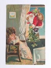 A Merry Christmas Santa Sneaking Past Sleeping Child Embossed Postcard c1910s picture