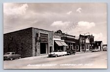 K1/ Clarence Iowa RPPC Postcard c1950s Bank Automobiles Stores  438 picture