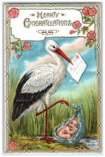 c1910's Hearty Congratulations Stork Delivering Baby Flowers Embossed Postcard picture