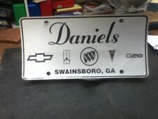Dealership License Plate Daniels Chevrolet Olds Geo Pontiac Swainsboro GA Paper picture