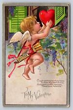 Antique Silver Trim Embossed Winsch Valentine PC Cupid Lifts Heart to Window picture