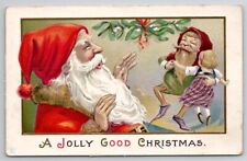 Jolly Christmas Santa Claus And Elf Dancing With Doll c1914 Emb Postcard Q30 picture