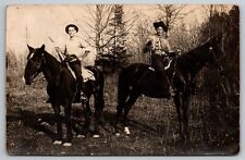 PostCard RPPC Cowboys horses Guns bullets belt early America | c1910s picture