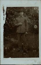 WWI RPPC German soldier standing outside Real Photo postcard message on back picture