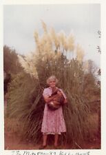 Found Photo Older Woman Holding Cat Tall Plant Original Vintage 1960s picture
