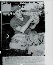 1959 Press Photo Boxer Gene Fullmer holding puppy in West Jordan, Utah picture