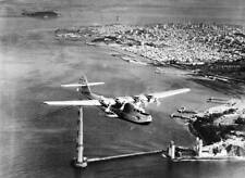 The China Clipper Is Shown Flying Over The Incomplete Golden Gate - Old Photo picture