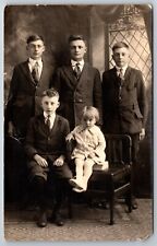 Early 1900s Family Photo Brothers Little Sister sitting on Book RPPC Postcard picture