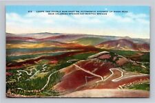 CO Loops & Double Bow Knot On Pikes Peak Highway near Colorado Springs Postcard picture