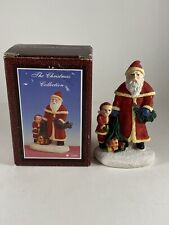 Young’s Inc Christmas Collection Santa Boy Presents Ceramic Figurine Holiday picture