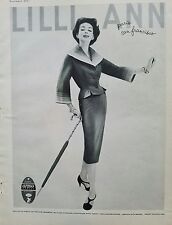 1957 women's suit by Llli Ann vintage fashion clothing umbrella ad picture