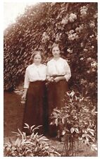 TWO YOUNG LADIES BY ROSE BUSH.VTG EARLY REAL PHOTO POSTCARD RPPC*A30 picture