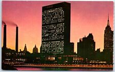 Postcard United Nations Building at night as seen from East River NYC New York picture