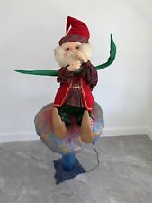 CHRISTMAS ANIMATED SANTA’S ELF SITTING ON A MUSHROOM. COMMERCIAL DISPLAY. picture