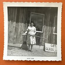VINTAGE PHOTO Woman with large rifle gun 1964 gift shop Original Snapshot Scary picture