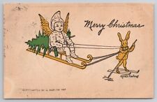 1907 Postcard Merry Christmas Anthropomorphic Rabbit Skies Pulling Sled & Child picture