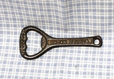 VINTAGE CAST IRON CROWN BOTTLE OPENER - MADE IN ENGLAND FROM 1936 picture