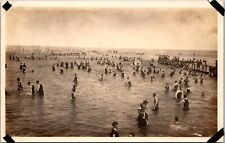 RPPC People Swimming in Ocean and Sitting on Pier c1910  Real Photo Postcard picture