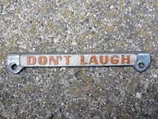 ---Vtg “Don’t Laugh” partial license plate topper frame picture