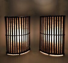 Pair of rattan lamps. Tropical inspired with linen lining. Nice ambient glow. picture
