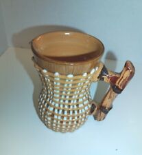 Brown Raised Relief Pitcher With Handle picture