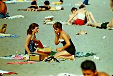VTG 1950s 35MM SLIDE BEACH SCENE BRUNETTES ON TOWEL MAKEUP KITS CANDID #2-14K picture