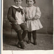 c1910s Cute Young Children RPPC Boy Girl Smirk Portrait Holding Hands Photo A192 picture