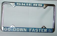 SKIERS GO DOWN FASTER VINTAGE 1970's METAL LICENSE PLATE FRAME SKI SKIING picture