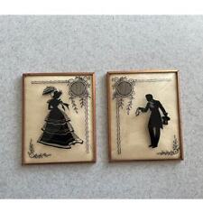 Pair of Vintage Metal Framed Convex Glass Reversed Silhouettes picture