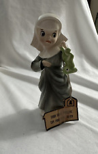 Humorous Figurine Sister Theresa Holding Frog Upside Down picture