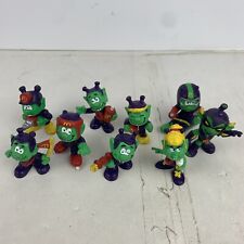 Lot of 9 1980s Mcdonalds Astroniks Various Years Green Alien Ray Gun Moon Sniks picture