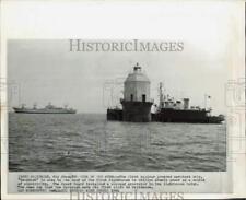 1964 Press Photo Nuclear powered merchant ship near lighthouse at Baltimore picture