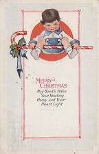 Christmas Boy In Blue Sitting Giant Candy Cane Holly Embossed c1920 postcard H66 picture