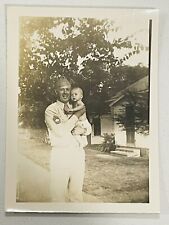 Vintage WW2 Soldier Holding a Baby picture