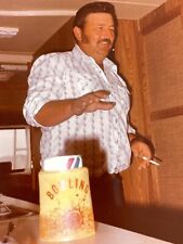 DD) Photograph Handsome 1970's Guy Beer Cozy Sideburns Smoking Cigarette RV  picture