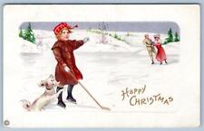 1915 HAPPY CHRISTMAS ICE HOCKEY SKATING PUPPY DOG ANTIQUE POSTCARD picture