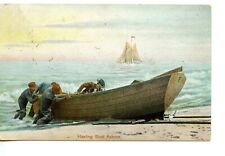 Men on Beach Hauling Rowboat Ashore-Vintage 1907 Postcard picture