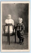 POSTCARD RPPC Two Children Standing in Chair Blonde Hair Boy c1904-20s picture