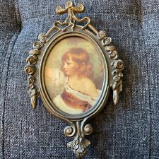 Vintage metal picture frame with picture of child. Made in Italy. Approx 6 1/2 “ picture