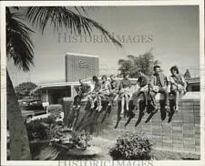 1963 Press Photo Students sit atop wall at South Dade High School - lra31564 picture