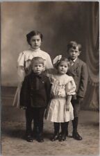 1910s RPPC Studio Photo Postcard Four Children / Siblings in Sunday Clothes picture